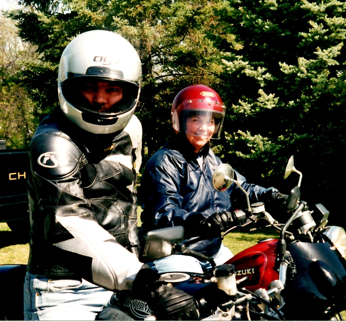 my mother and I on our motorcycles, a Triumph Speed Triple and a Suzuki GN125