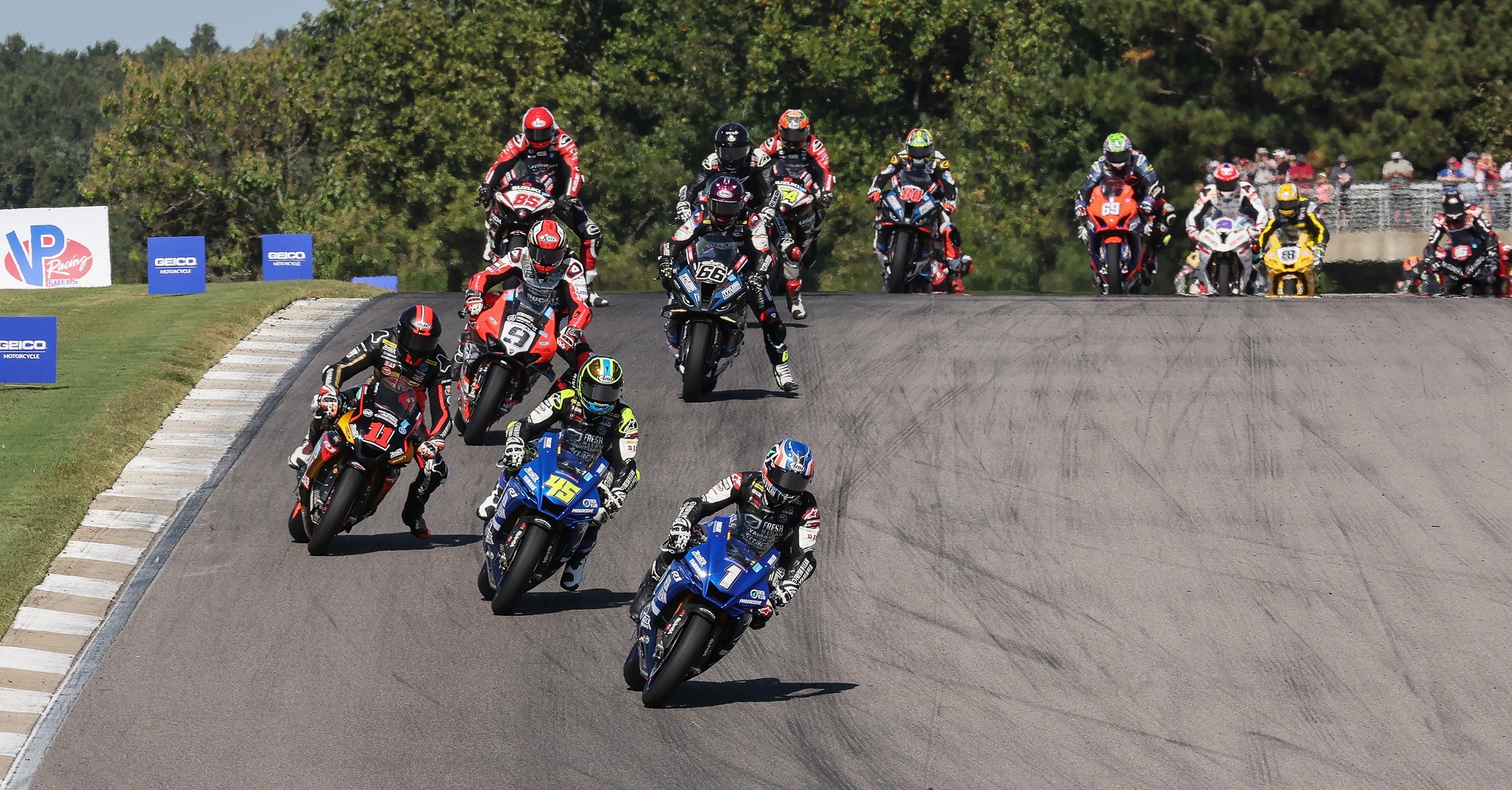 The Superbike field in close formation at the beginning of Saturday's race