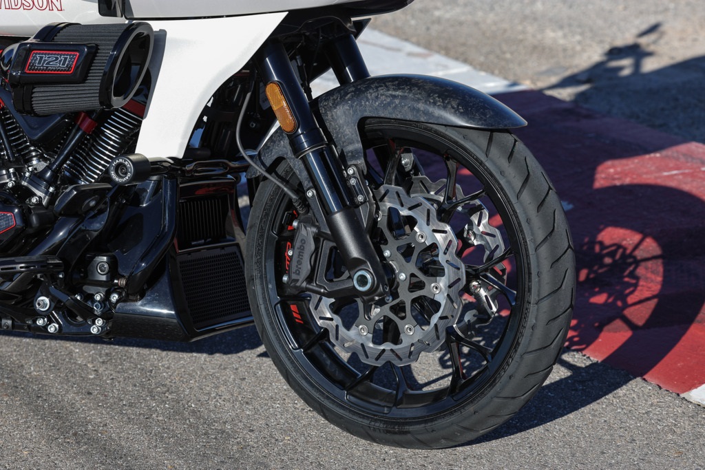 close shot of the front wheel and Brembo brakes
