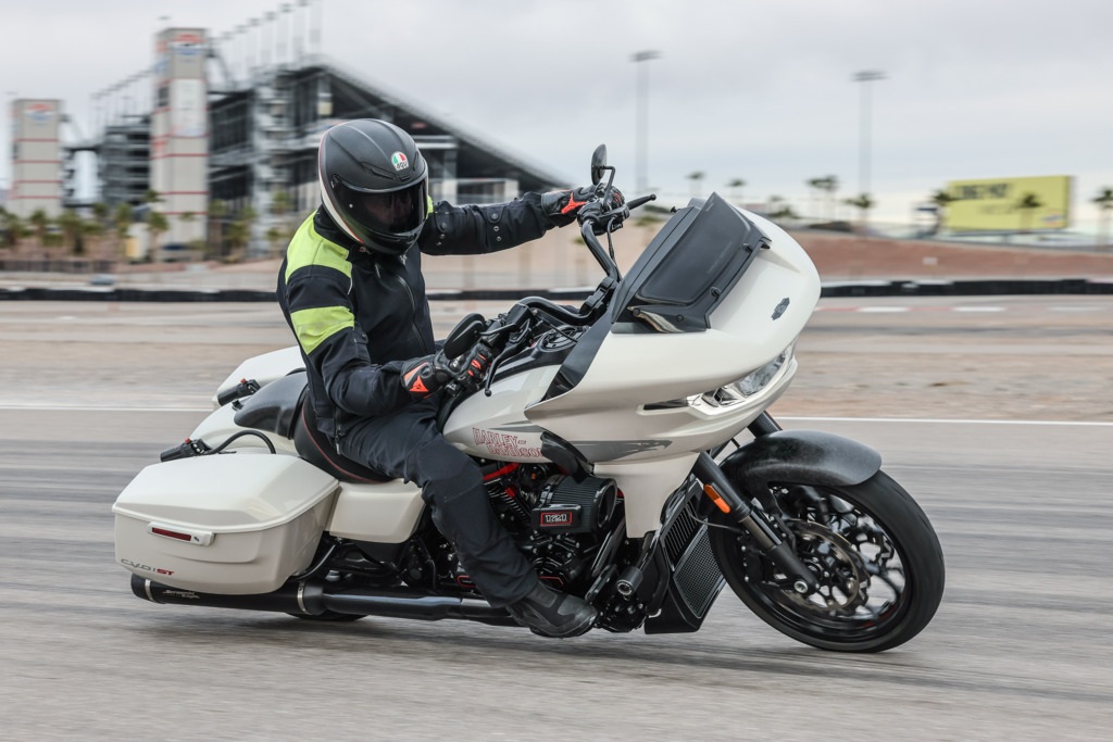 author on a white CVO Road Glide ST on a race track in a corner