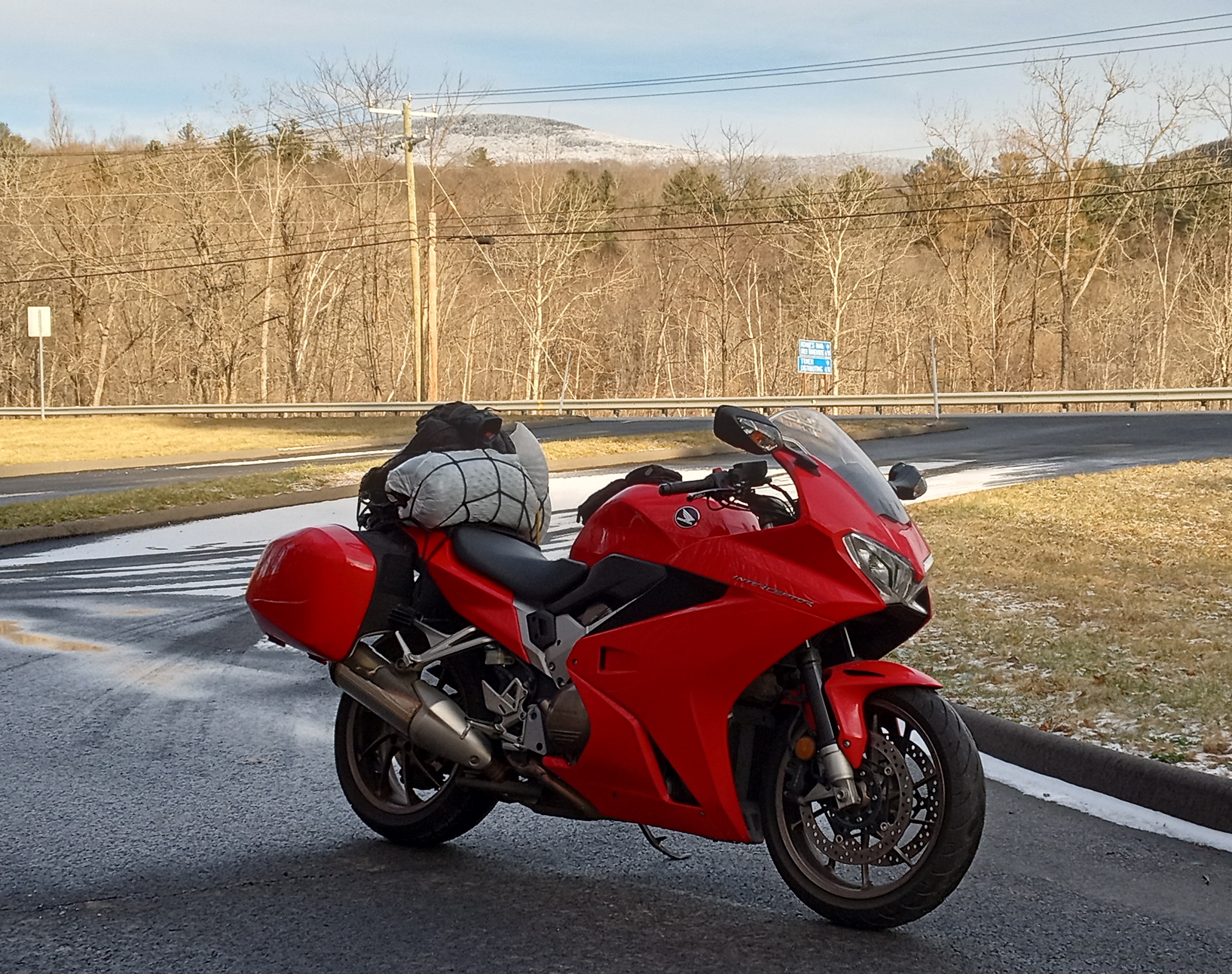 Honda VFR800 parked at a pull off with frosty Mount Greylock in the distance