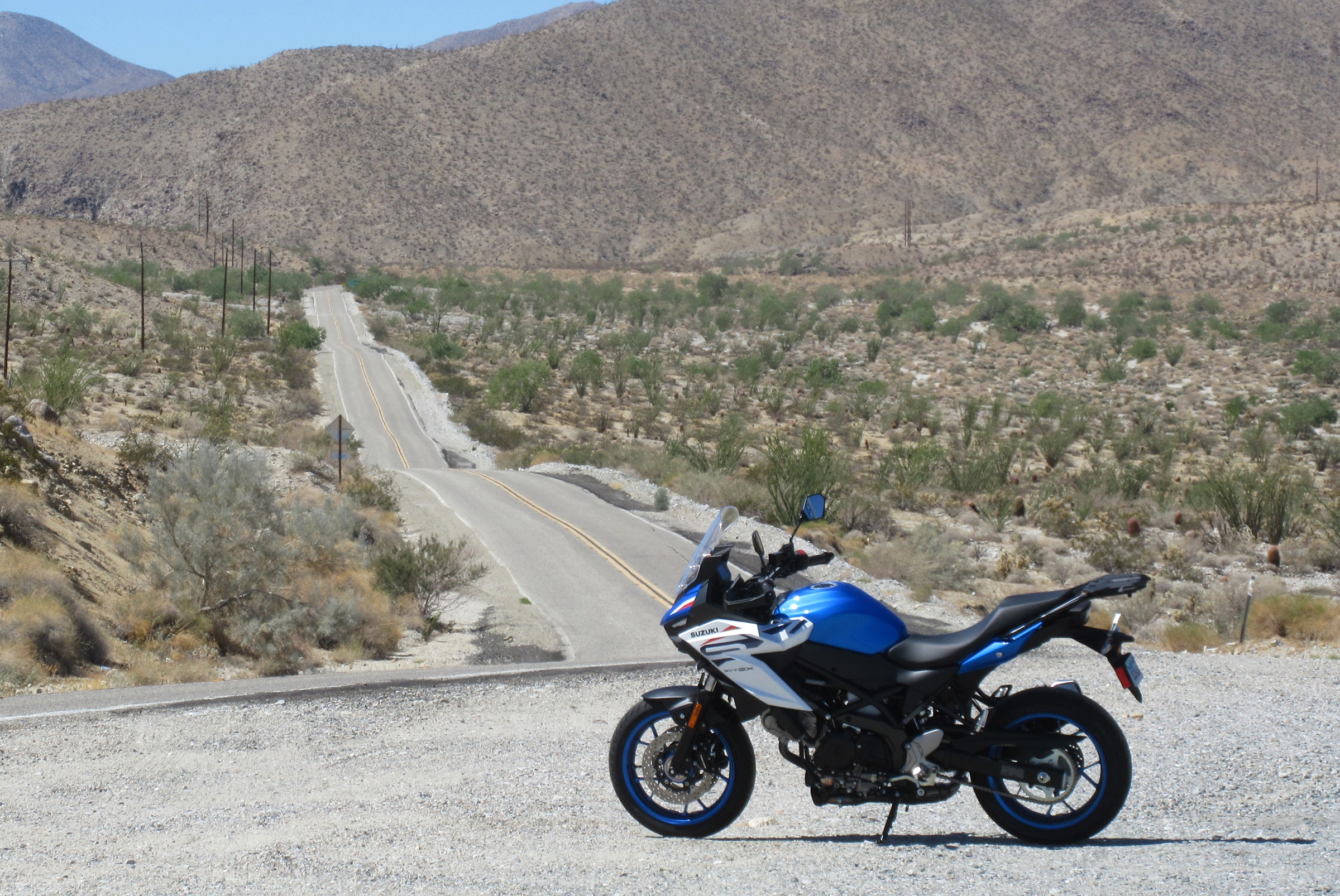 SV-7GX parked along a long, open and empty desert road