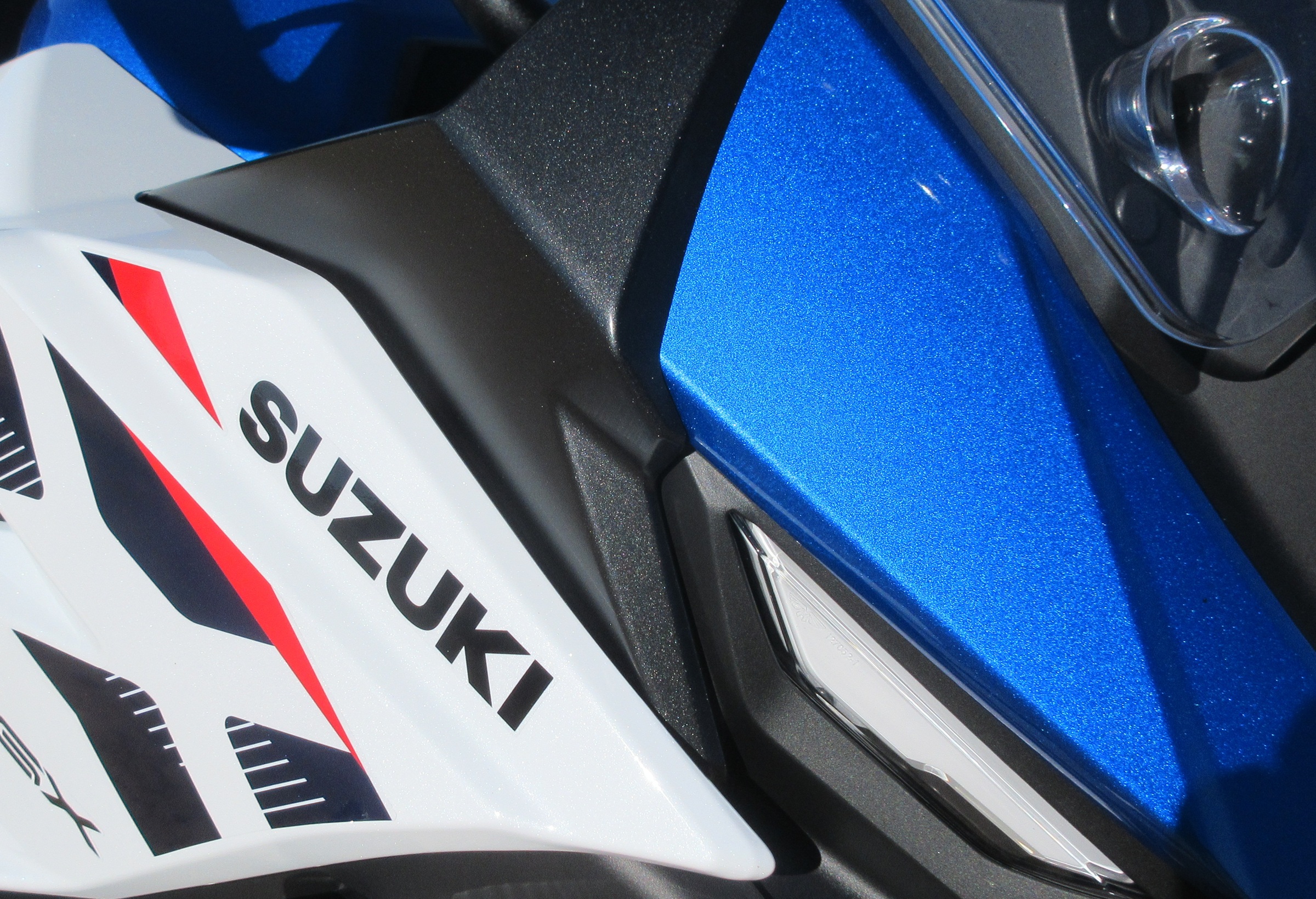 close view of the blue and white paint in the sunlight