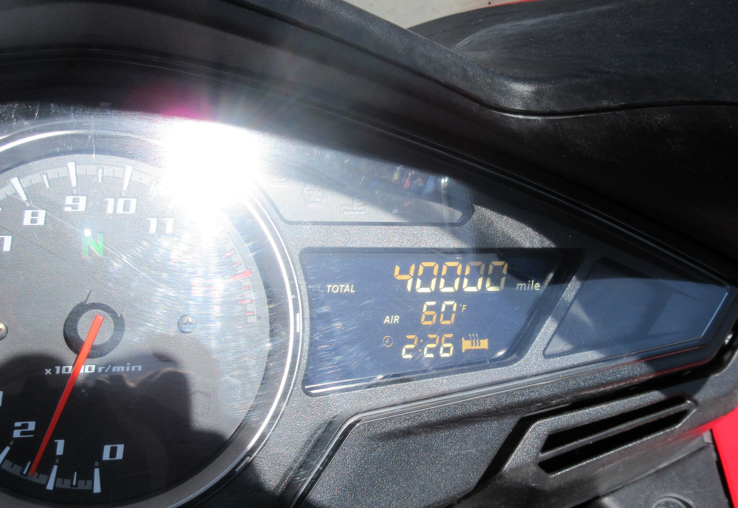 close shot of a digital display on my VFR800 showing 40,000 miles exacty